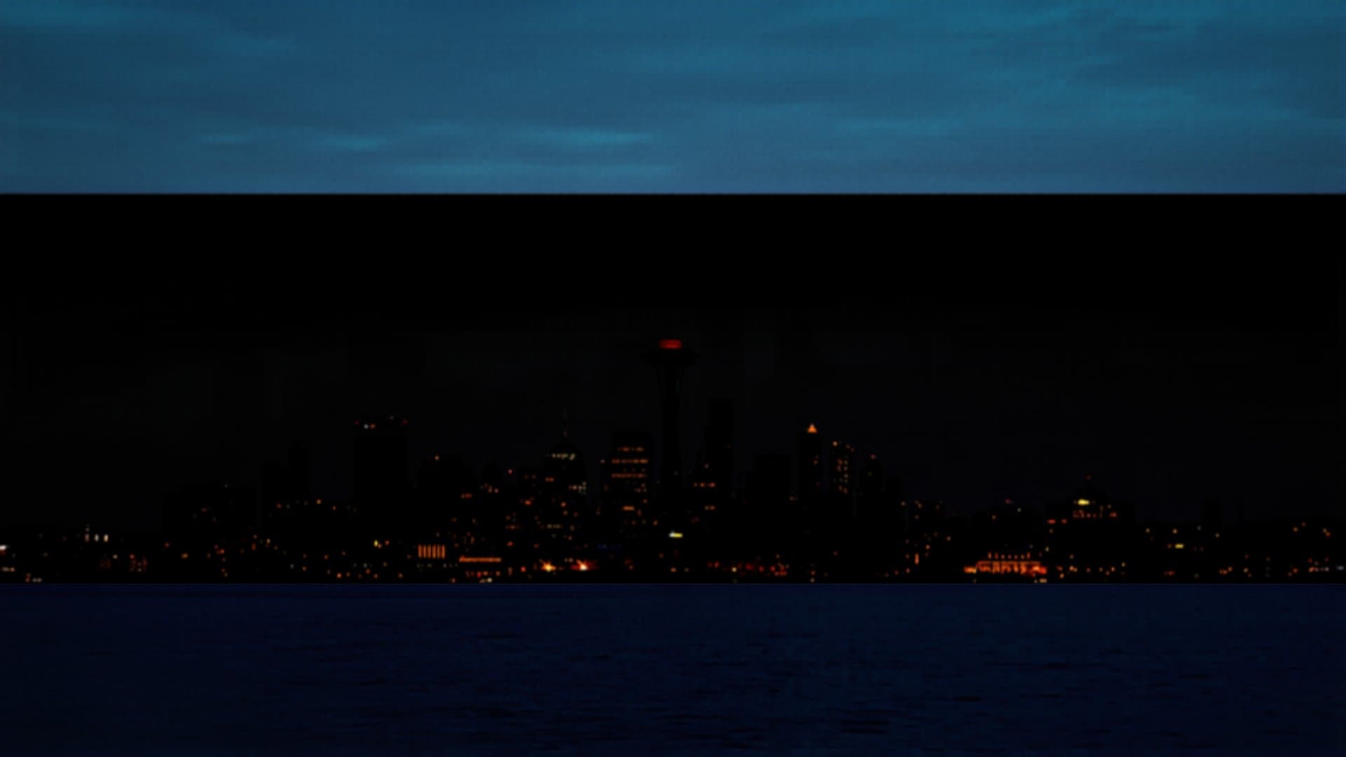 Seattle Washington skyline at dusk with Space Needle and Puget Sound